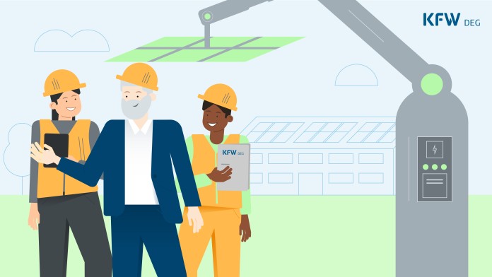 The project managers next to a robot putting solar panels on a roof