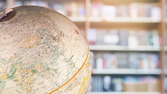 Globe in front of a book shelf