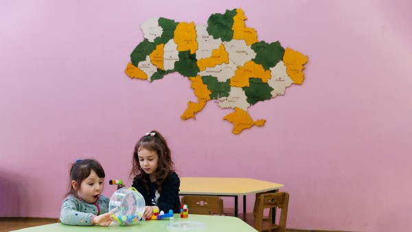Two children play at a table in kindergarten № 14 (renovated by USIF) in Lviv. 
