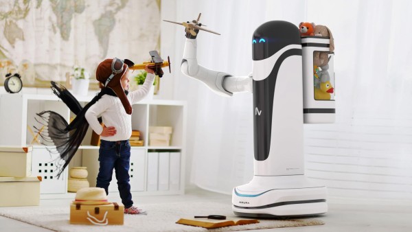 A Child standing in front of a roboter of Neura